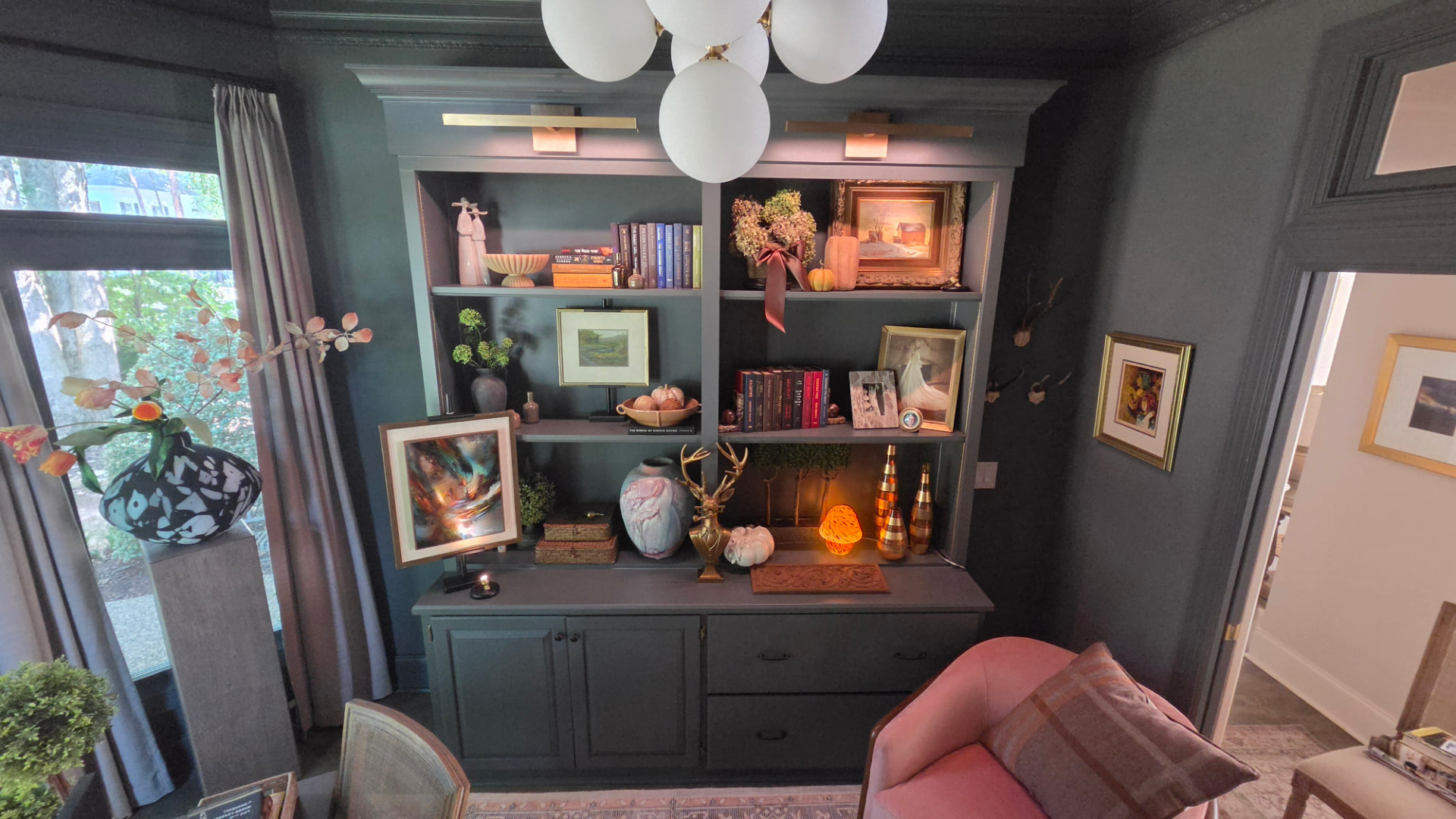 Moody midcentury modern study with custom maple bookcase built-ins