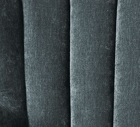 Close view of the vertical channel seams in the slate blue velvet upholstery of the Pierce & Ward accent chair